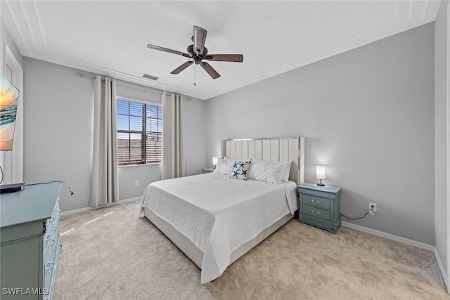 bedroom with crown molding, light colored carpet, and ceiling fan