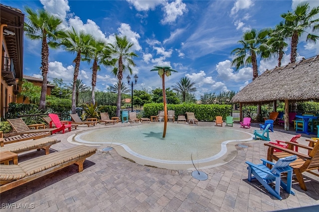 view of swimming pool featuring a gazebo and a patio area