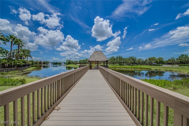 view of home's community with a gazebo and a water view