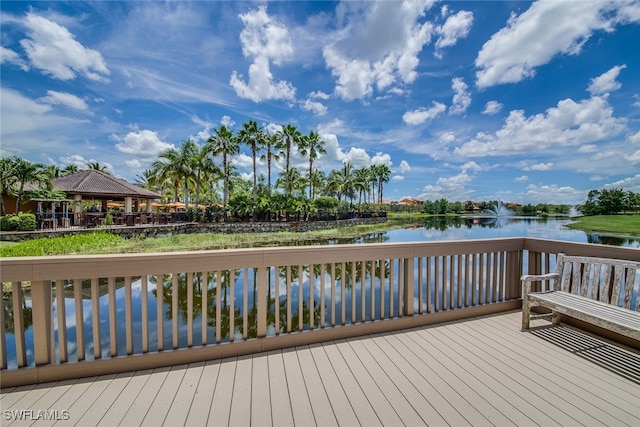 wooden deck featuring a gazebo and a water view