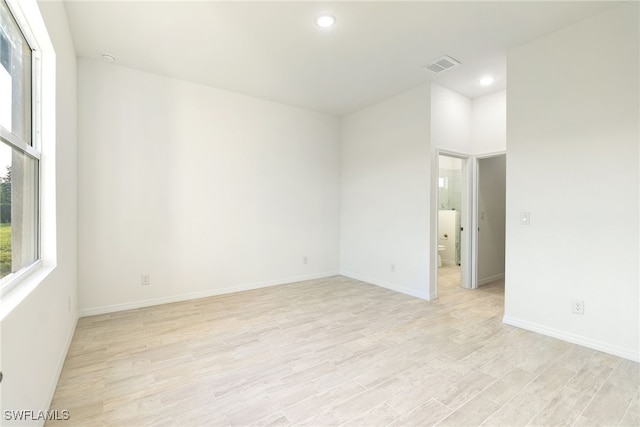 spare room featuring light hardwood / wood-style flooring