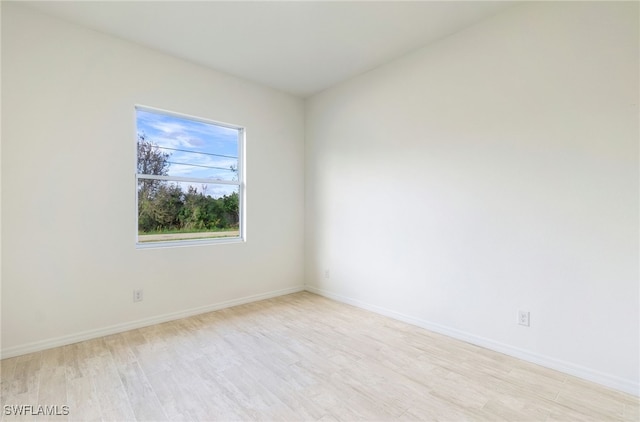 unfurnished room featuring light hardwood / wood-style flooring