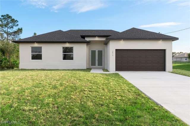 view of front of house featuring a front yard and a garage