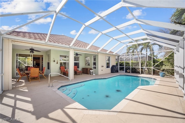 view of pool featuring a patio area, a lanai, and ceiling fan