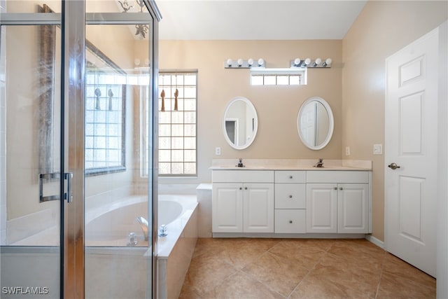 bathroom featuring vanity, a healthy amount of sunlight, independent shower and bath, and tile patterned flooring