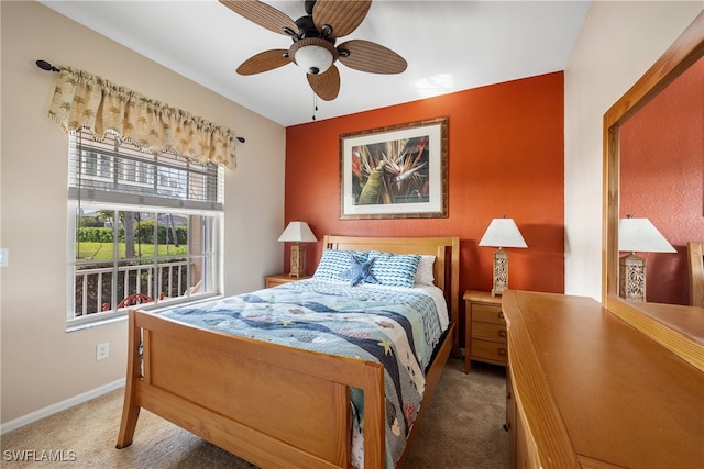 carpeted bedroom with ceiling fan