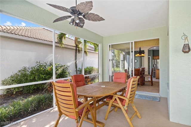 sunroom featuring ceiling fan