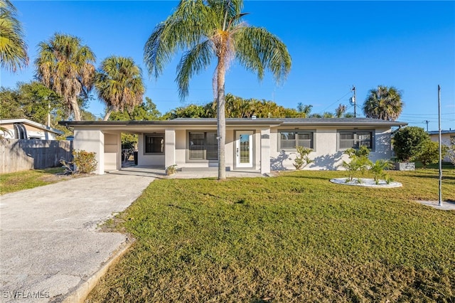 single story home with a front lawn