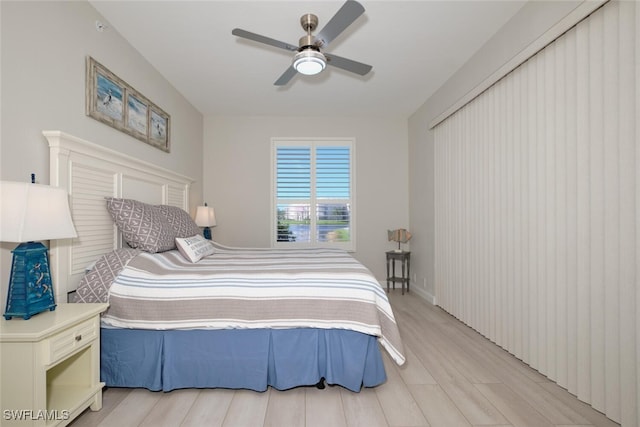 bedroom featuring light hardwood / wood-style floors and ceiling fan