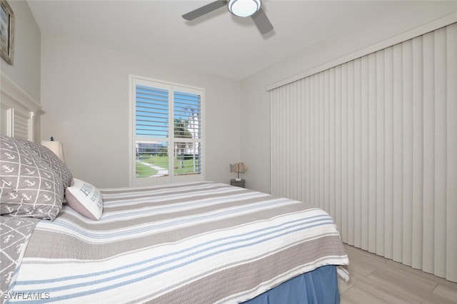 bedroom featuring light hardwood / wood-style flooring and ceiling fan