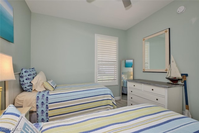 bedroom with light hardwood / wood-style flooring and ceiling fan