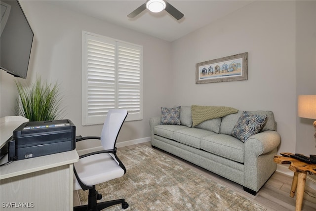 office space featuring light hardwood / wood-style floors and ceiling fan