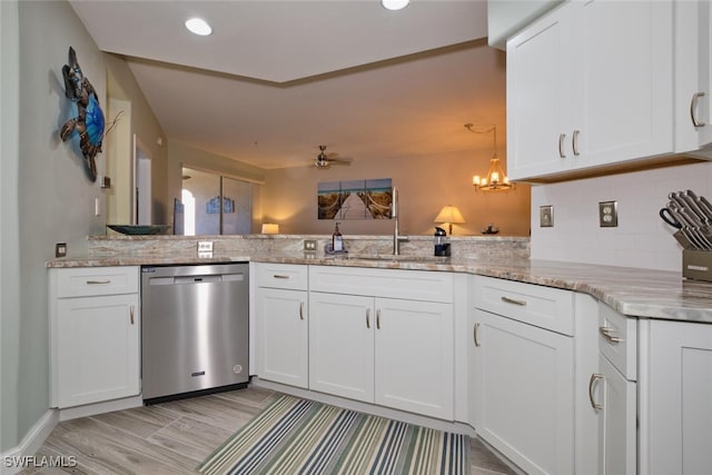 kitchen featuring stainless steel dishwasher, white cabinets, kitchen peninsula, and light hardwood / wood-style flooring