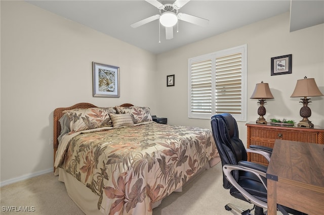 bedroom featuring light colored carpet and ceiling fan