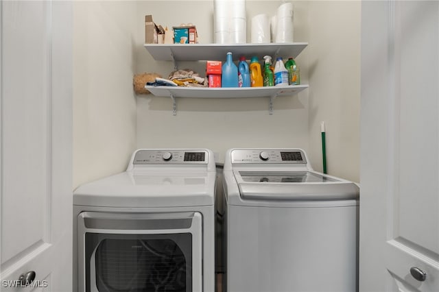 washroom featuring independent washer and dryer