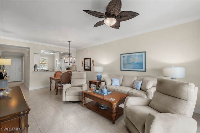 living room with ornamental molding, light tile patterned flooring, and ceiling fan with notable chandelier