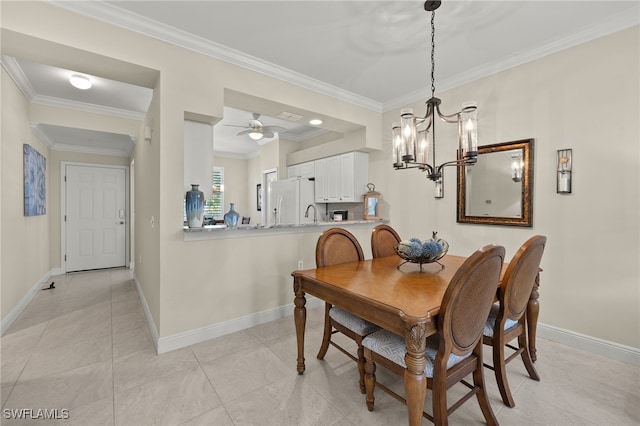 tiled dining area featuring crown molding and ceiling fan with notable chandelier