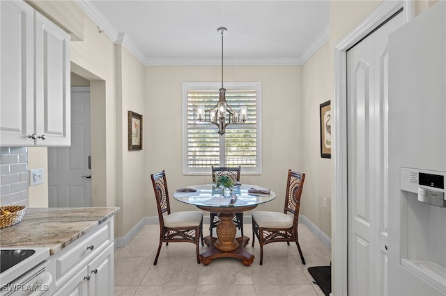 tiled dining space with a notable chandelier and ornamental molding