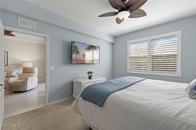 bedroom featuring light colored carpet and ceiling fan