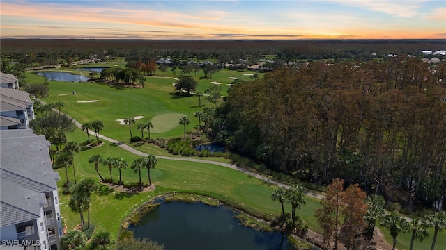 aerial view at dusk with a water view