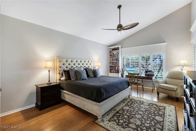 bedroom with high vaulted ceiling, hardwood / wood-style floors, and ceiling fan