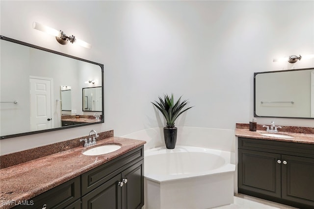 bathroom featuring a bath and vanity