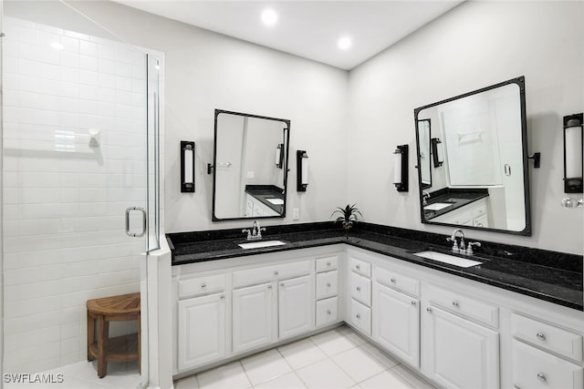 bathroom with vanity, tile patterned flooring, and a shower with shower door