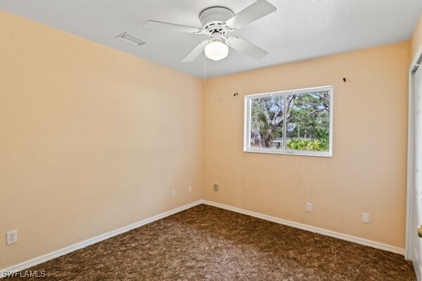 carpeted empty room with ceiling fan