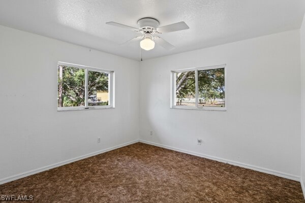 carpeted empty room with ceiling fan