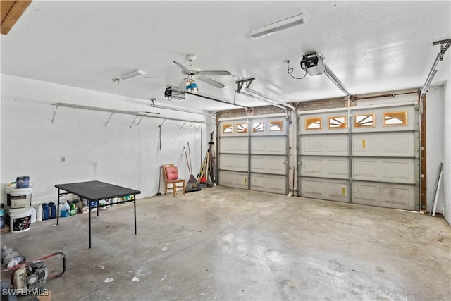 garage featuring ceiling fan and a garage door opener