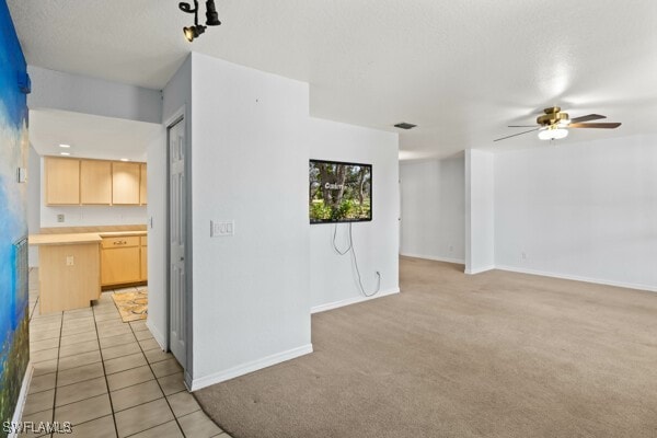 interior space featuring ceiling fan