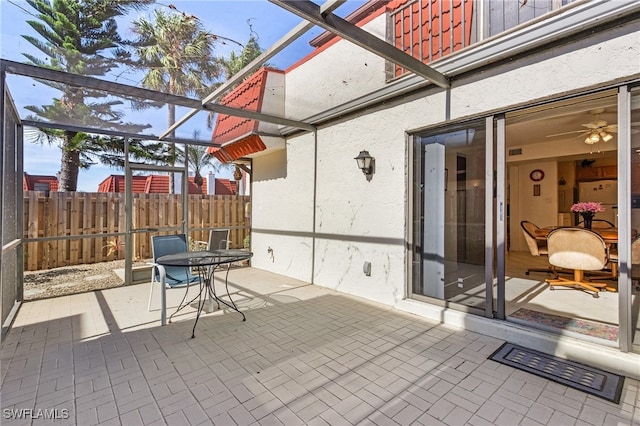 view of patio / terrace featuring a lanai