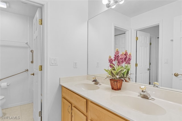 bathroom with tile patterned floors, vanity, and toilet