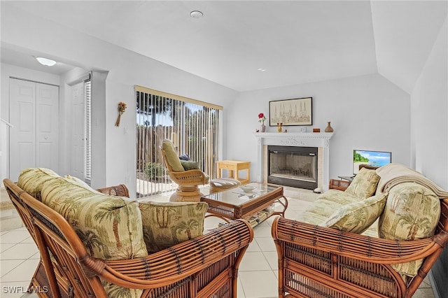 tiled living room featuring a fireplace and vaulted ceiling