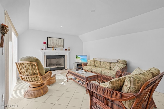 living room featuring light tile patterned floors and vaulted ceiling