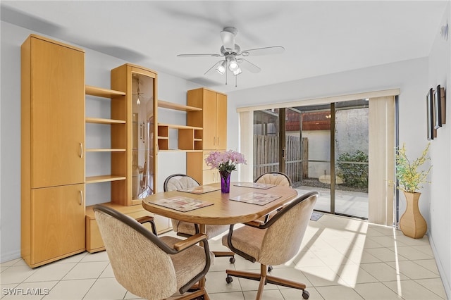 dining space with ceiling fan and light tile patterned floors