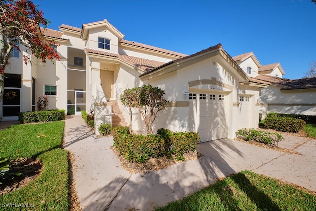 mediterranean / spanish-style home with a garage