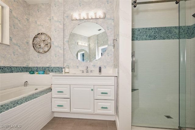 bathroom with vanity, tile patterned floors, and separate shower and tub