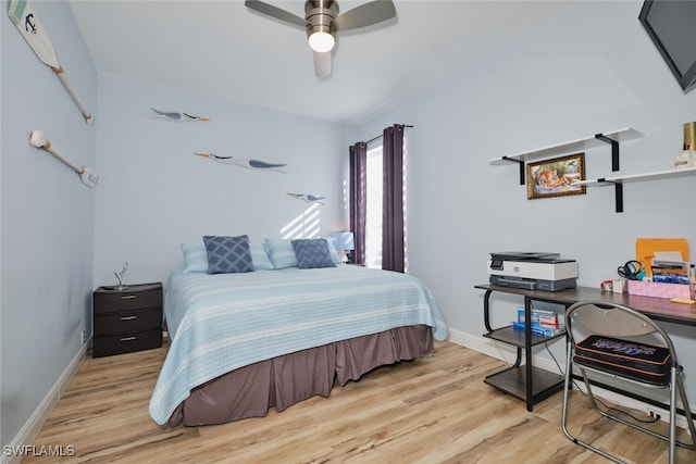 bedroom featuring light hardwood / wood-style flooring and ceiling fan