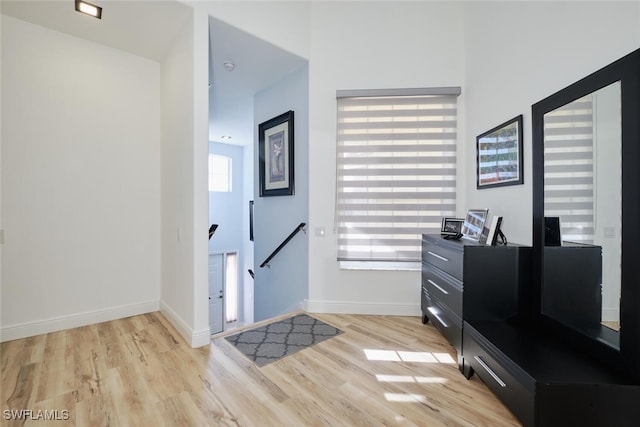 foyer entrance with light wood-type flooring