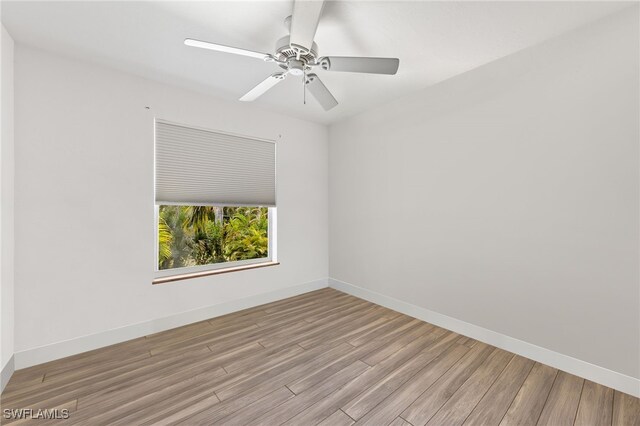 838-840 Rabbit Rd, Sanibel, FL 33957 - empty room featuring ceiling fan, wood finished floors, and baseboards