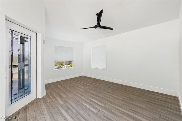 unfurnished room featuring hardwood / wood-style flooring and ceiling fan