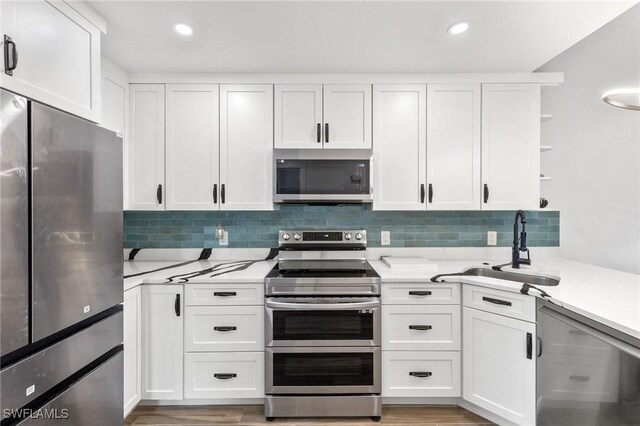 838-840 Rabbit Rd, Sanibel, FL 33957 - kitchen with a sink, open shelves, stainless steel appliances, and white cabinetry
