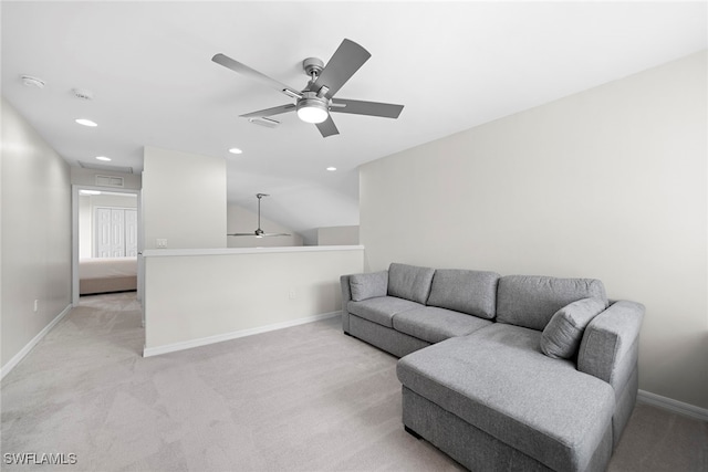 carpeted living room featuring ceiling fan and vaulted ceiling