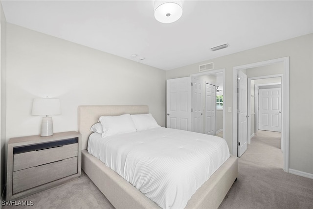 carpeted bedroom with a closet