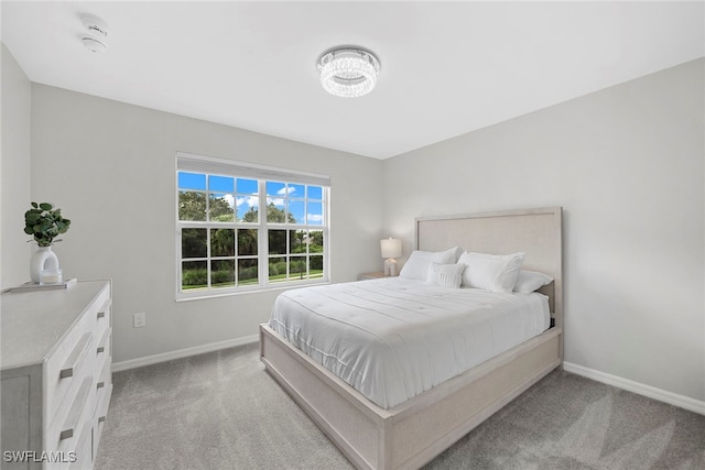 bedroom with light carpet