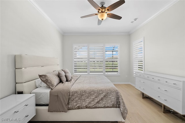 bedroom featuring crown molding, light wood-type flooring, and ceiling fan