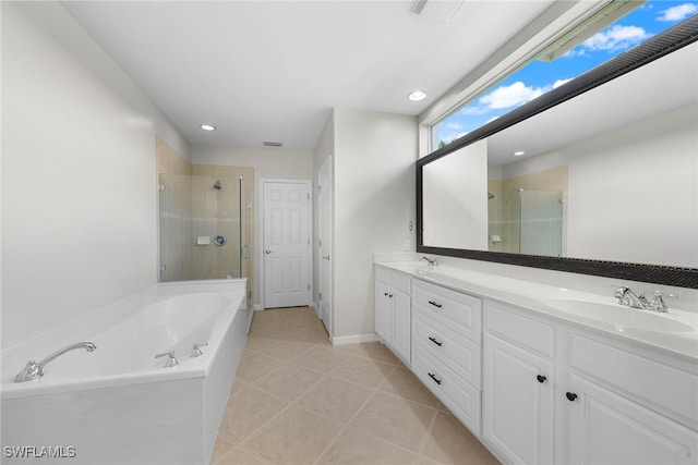 bathroom featuring vanity, tile patterned floors, and separate shower and tub