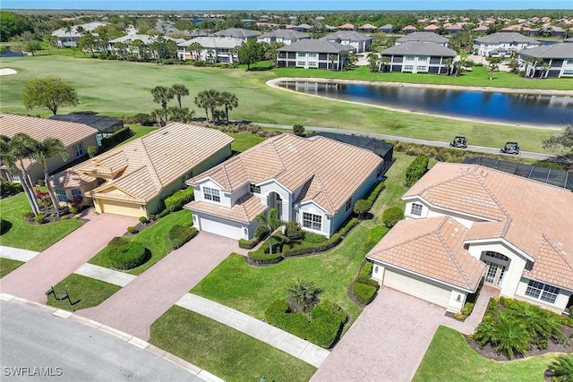 birds eye view of property featuring a residential view and a water view