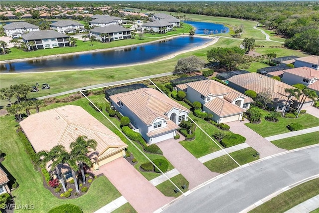 aerial view with a water view and a residential view